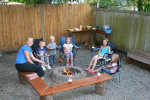 Friends over to celebrate National S'more day and to roast hot dogs on the fire