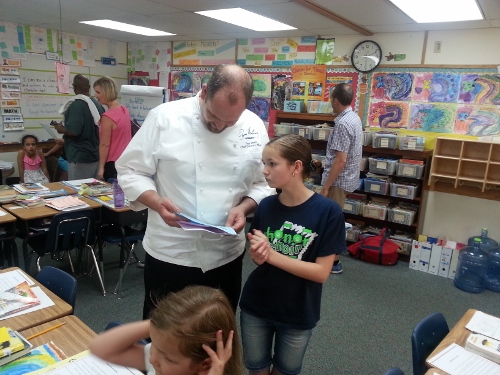 We started off in Sage's 4th grade classroom. I was so impressed with her writing! Here she is going over it with Tom.